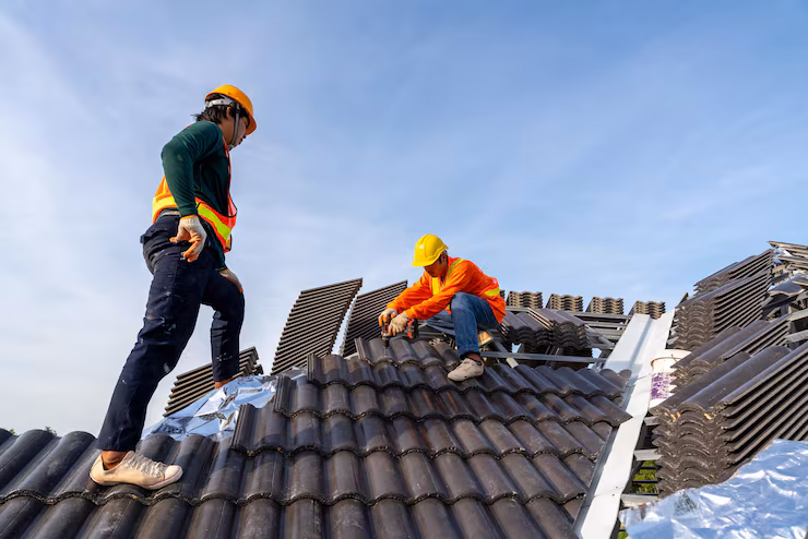 2-construction-workers-install-new-roof-construction-site-electric-drill-used-new-roofs-with-concrete-roof-tiles-concept-residential-building-construction_61243-1559