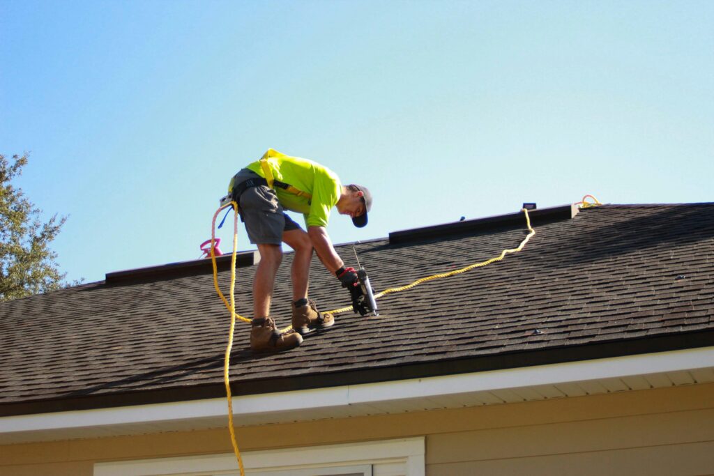 A Construction Worker Repairing the Roof